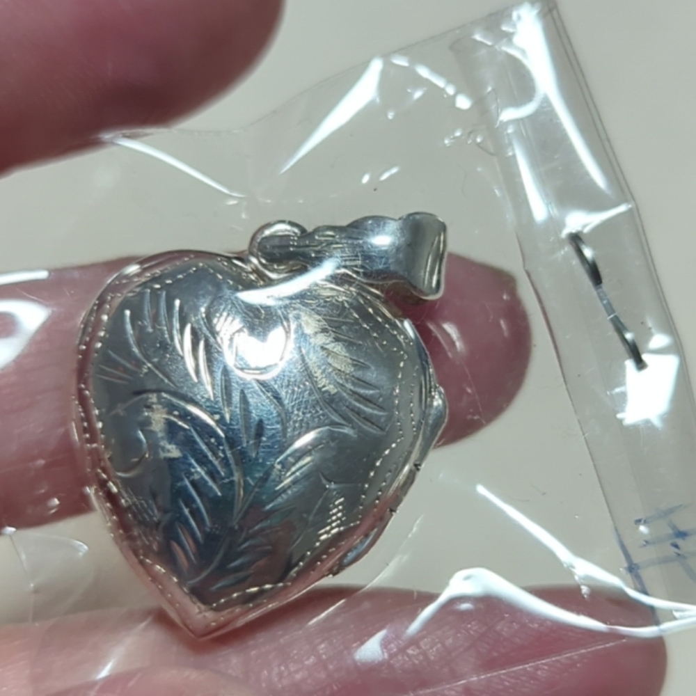 Beautiful 925 heart shaped lockets.
